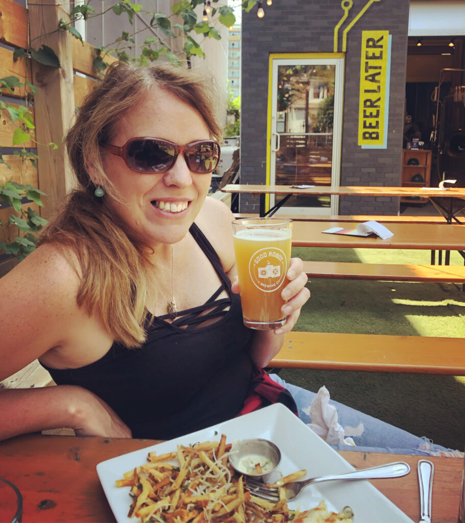 Suzy drinking a craft beer in the North End of Halifax